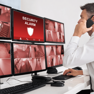 Guy looking at a security alert on computer