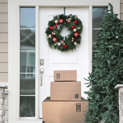 christmas door with packages in front of it