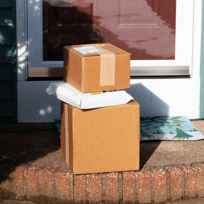 three stacked packages on front porch