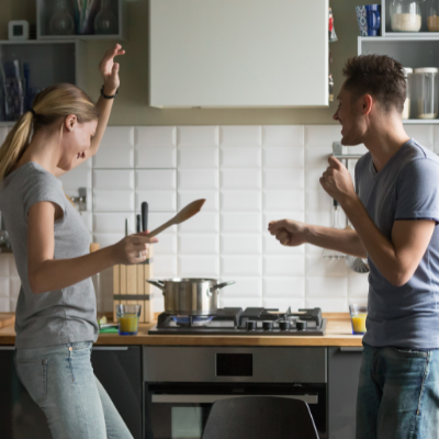 Couple dancing in kitchen
