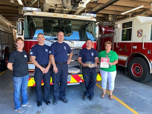 Denelle Hilliard from our Bemidji branch presenting lunch to the local fire department as a thank you for all they did.