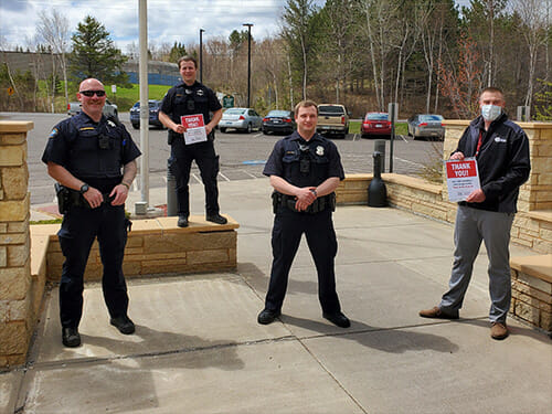 David Corder from our Duluth branch with officers from the Duluth Police Department.
